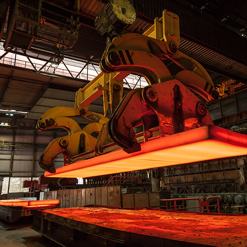 manufacturing facility with heat press bright orange glow